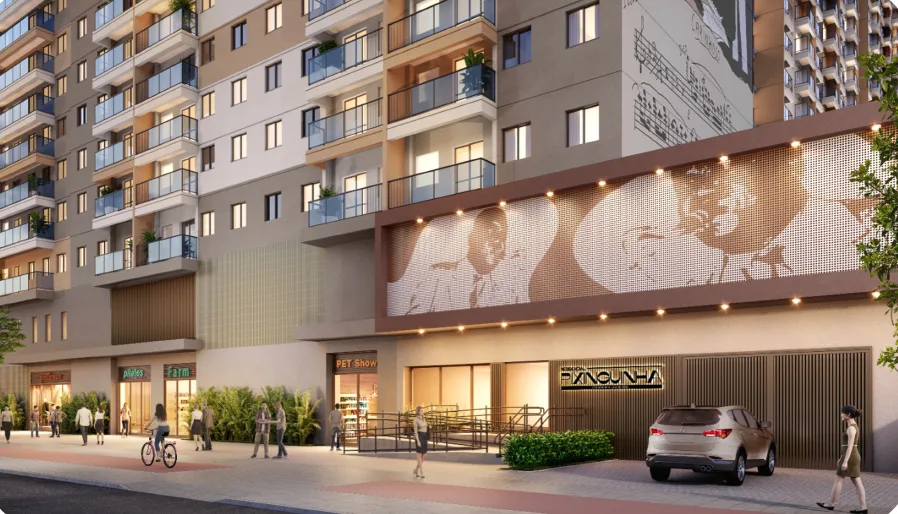 Fachada comercial de um empreendimento Cury ao anoitecer