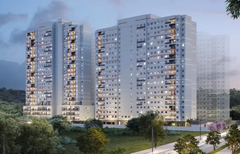 Duas torres residenciais da Cury ao anoitecer